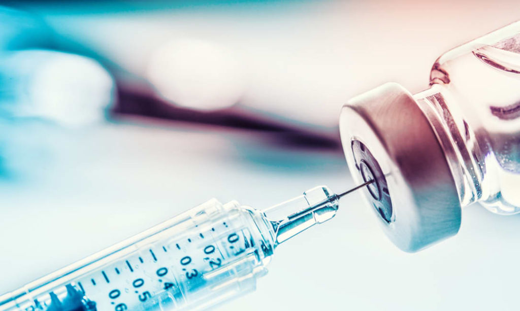 A syringe extracting insulin